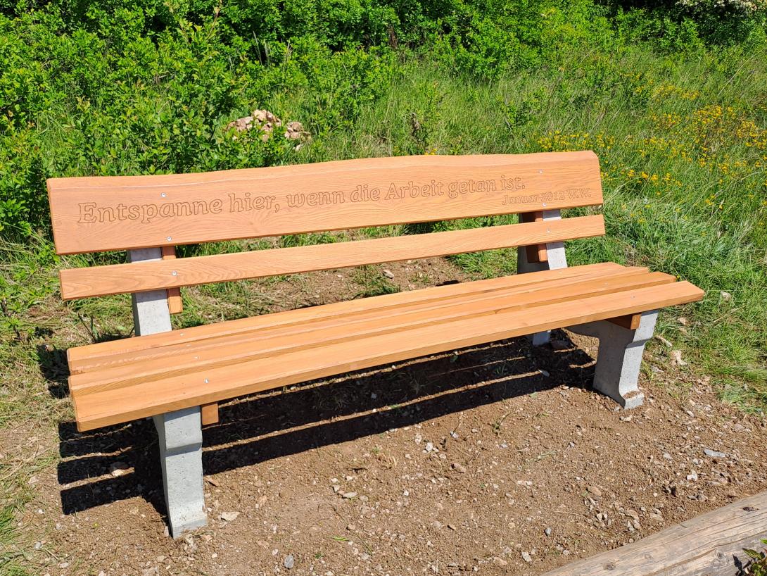 Slatted bench with milled dedication